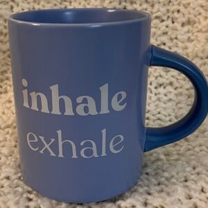 Indigo light blue mug, says Inhale, Exhale.